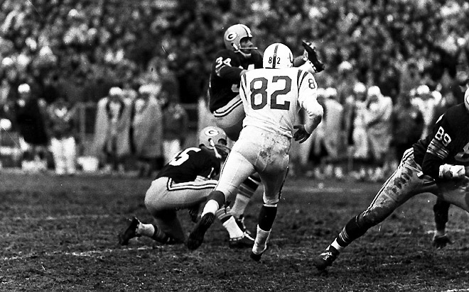 Packers - Packers - Bart Starr holds for Don Chandler in the Green Bay Packers vs. Baltimore Colts football game in 1965. Negative # 653794 PUBLISHED: 12-27-1965, Milwaukee Journal