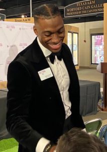 RG3 shakes a fan's hand at the Texas Sports Hall of Fame.